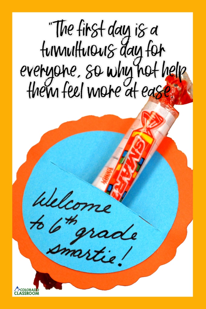 A scalloped orange disc, with a light blue disc on top, which holds a Smartie candy. Above is the text, "The first day is a tumultuous day for everyone, so why not help them feel more at ease." All of this is inside a golden yellow rectangular frame.