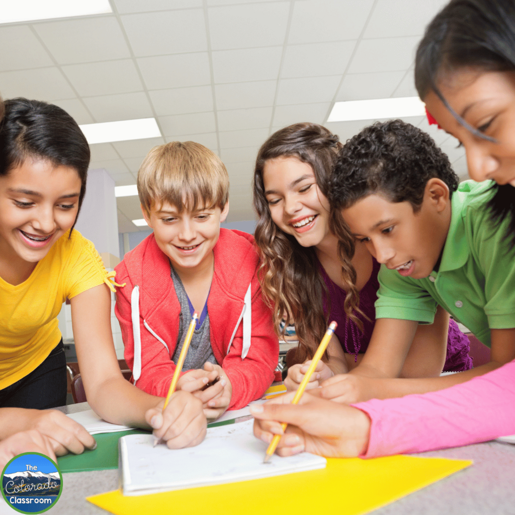 This photo shows a group of middle school students engaged in collaborative learning.